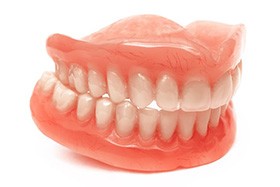 Upper and lower dentures pictured against plain white background