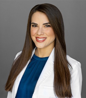Dr. Priscila Schaefer in her white clinic coat