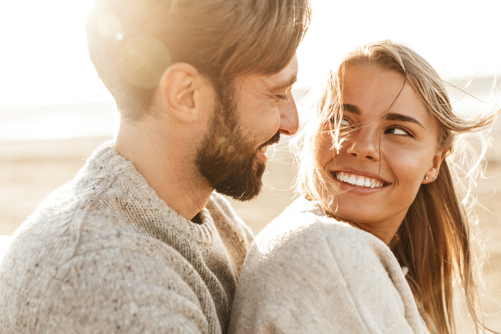 Relaxed couple smiling at each other